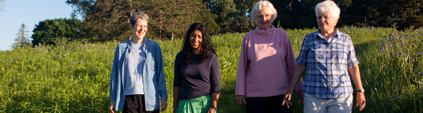 Sisters walking together in the prairie
