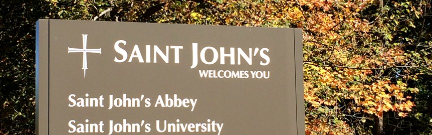 Sign reading "St John's welcomes you"