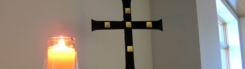 the light of faith and hope seen in the candle, cross and window of the oratory