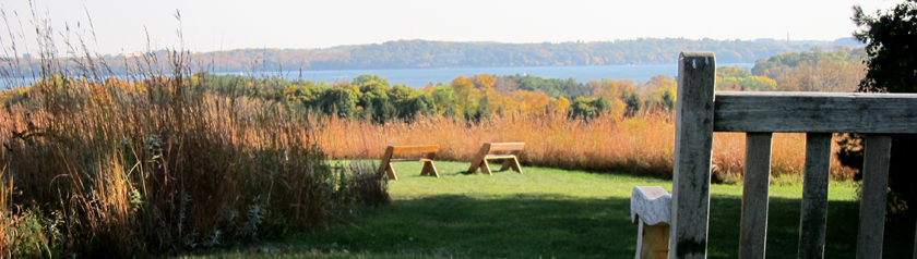 Perspective from monastery hilltop overlooking prairie, Lake Mendota and Madison in the distance.