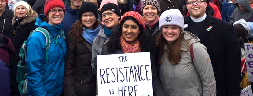 Sister Rosy and friends holding sign reading "The Resistance is HERE"