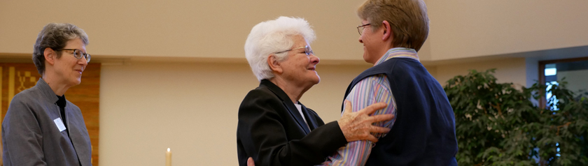Susan Pearson receives a hug from Sister Mary David Walgenbach with Sister Lynne Smith standining close by.